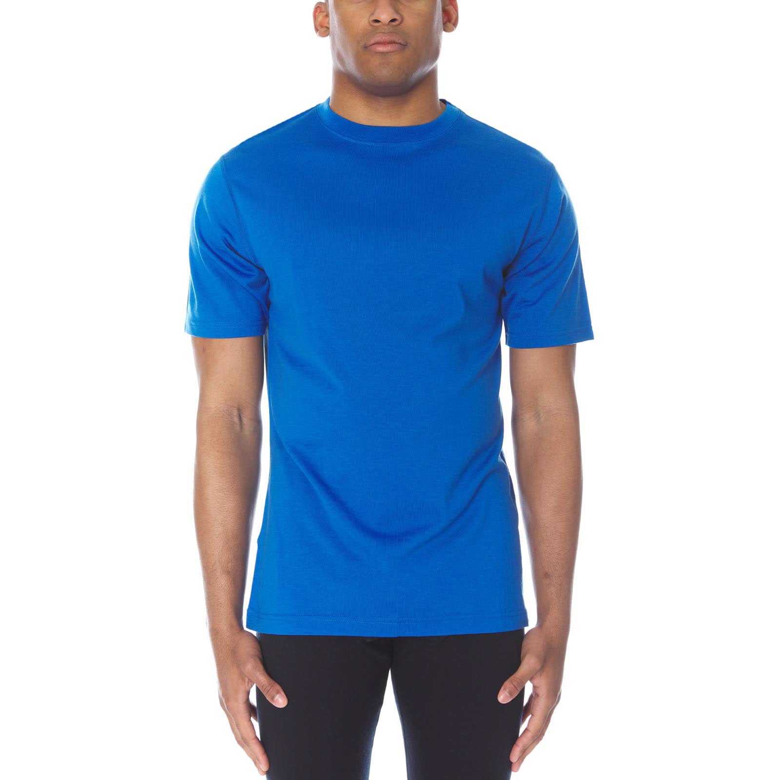 A man wearing an Azure blue 100 percent merino wool t shirt shown from the waist up against a solid background.