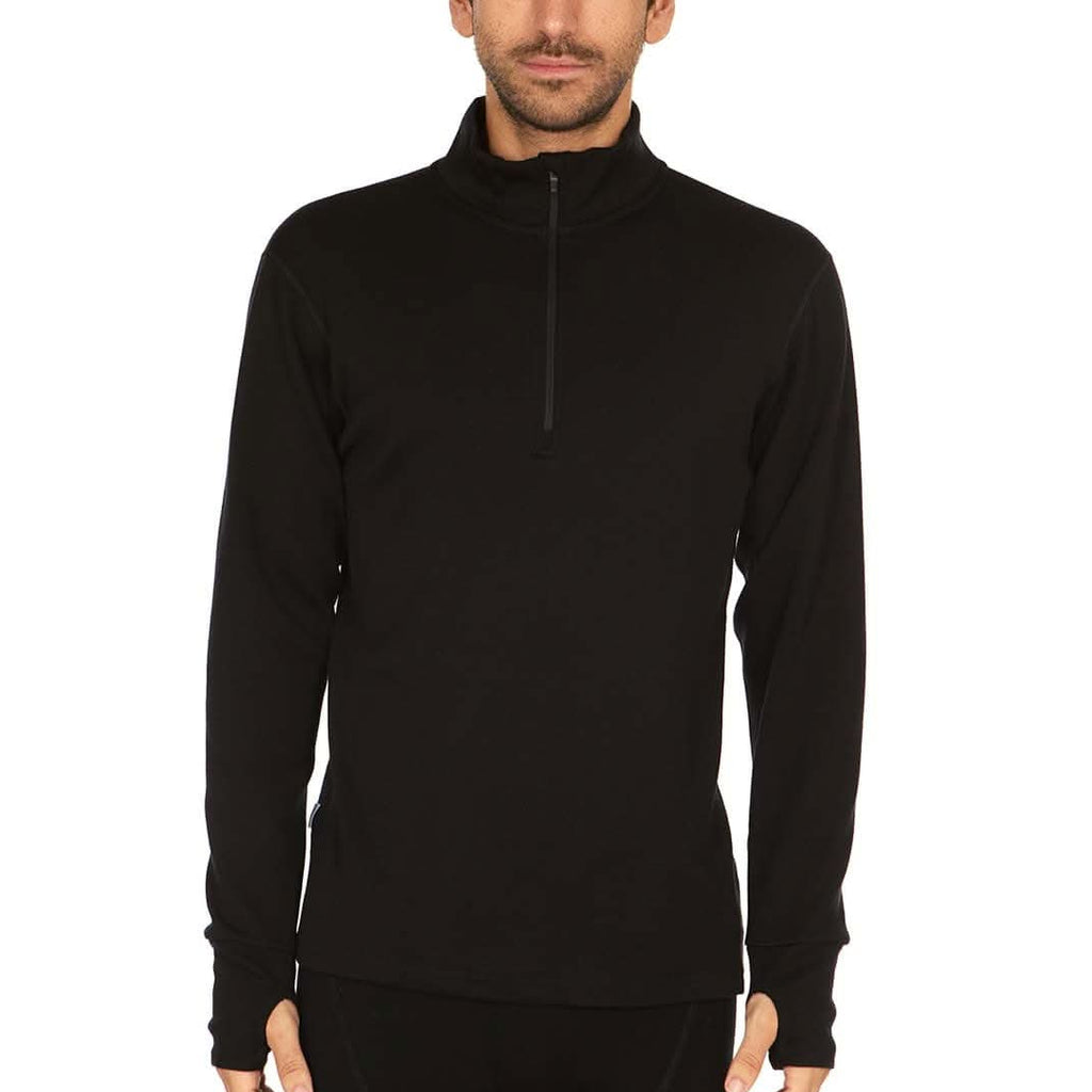 A man wearing a black 100 percent merino wool athletic quarter zip shown from the waist up against a solid white background.