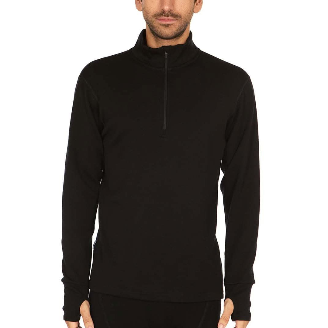 A man wearing a black 100 percent merino wool athletic quarter zip shown from the waist up against a solid white background.