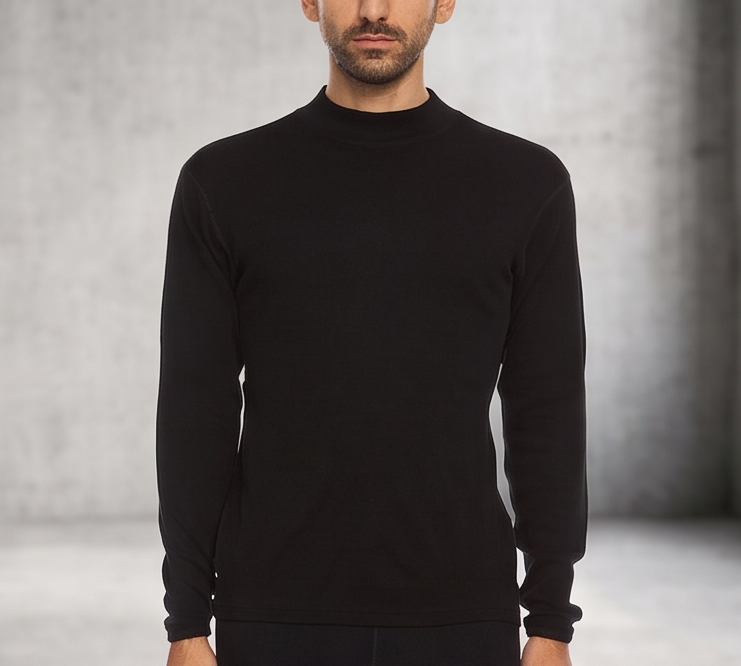 A man wearing a black 100 percent merino wool mock neck shown from the waist up against a textured grey background.