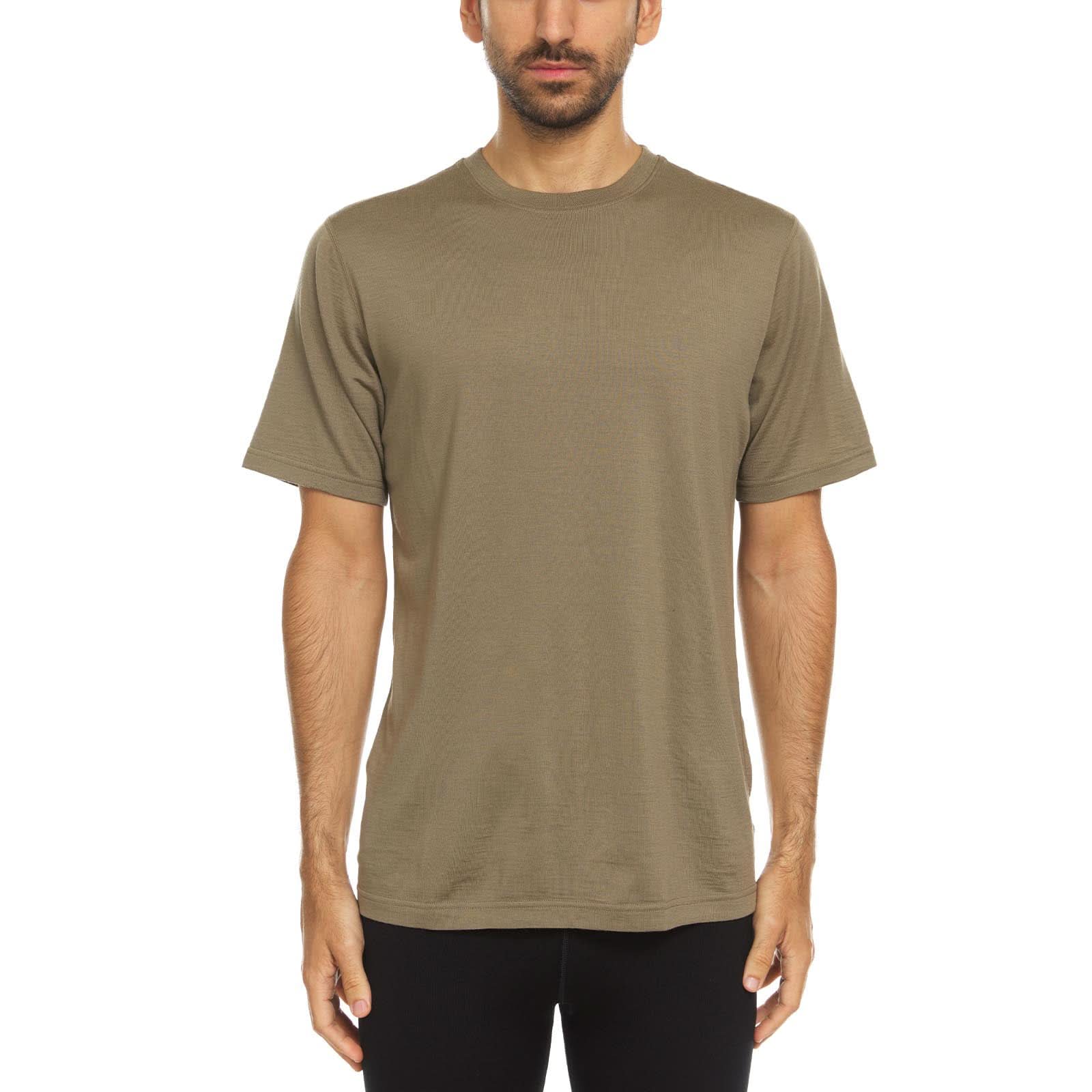 A man wearing a Tan 499 T-shirt in 100 percent fine merino wool - shown from the waist up against a solid white background.