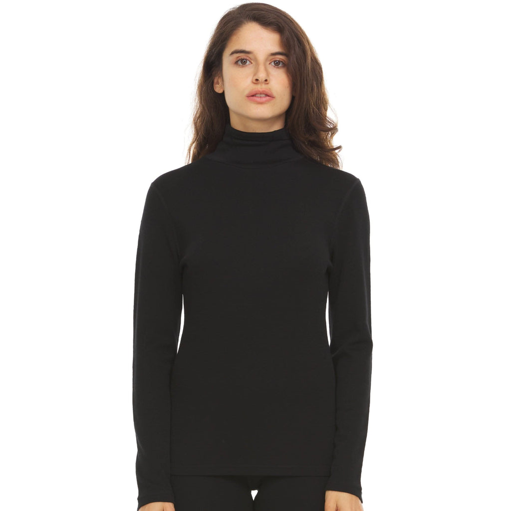A woman wearing a black 100 percent merino wool turtleneck shown from the waist up against a solid white background.