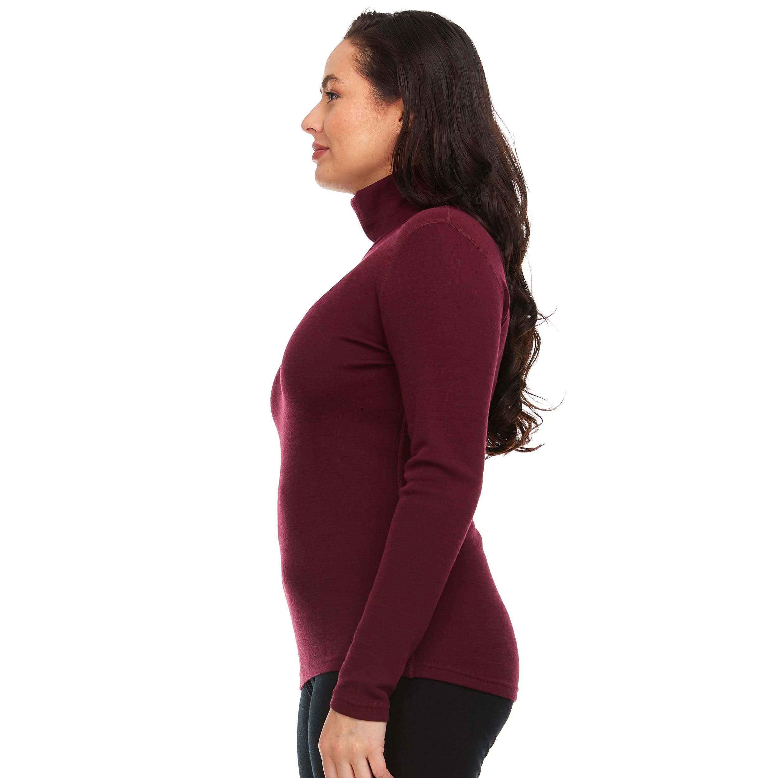 A woman wearing a burgundy 100 percent merino wool turtleneck shown from the side against a solid white background.