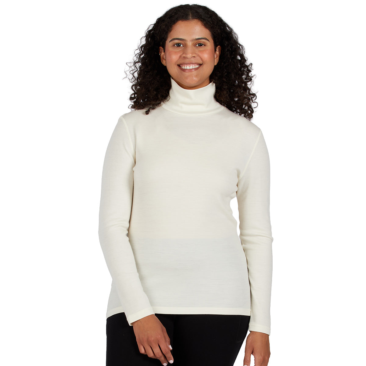  A smiling woman wearing a cream 100 percent merino wool turtleneck shown from the waist up against a solid white background.