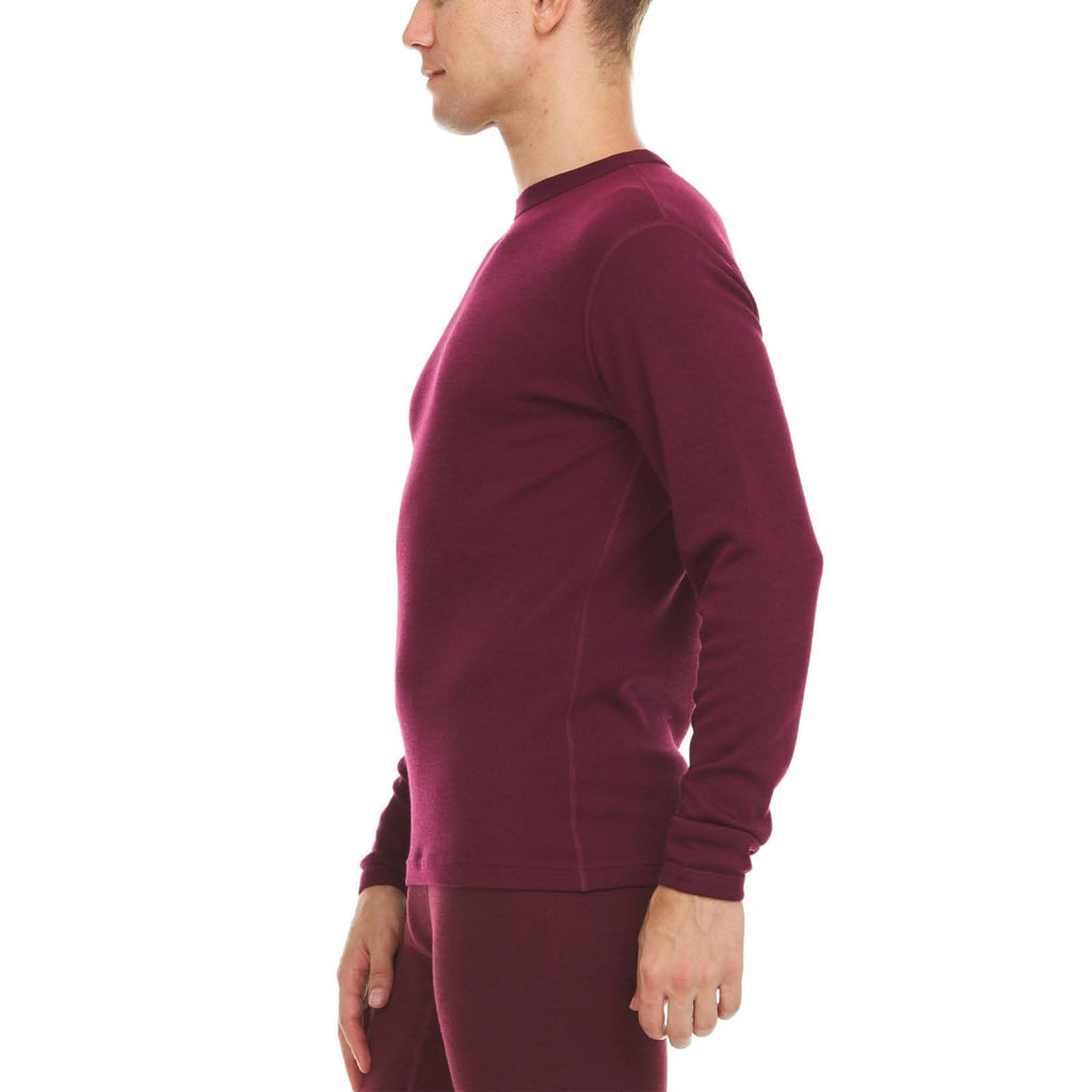 Person wearing a burgundy long-sleeve 100% merino wool base layer top on a white background