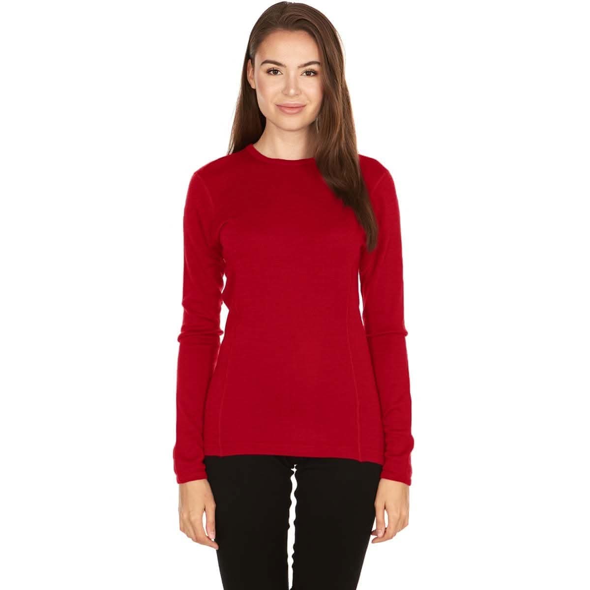Woman wearing a red 100 percent merino wool base layer on a white background