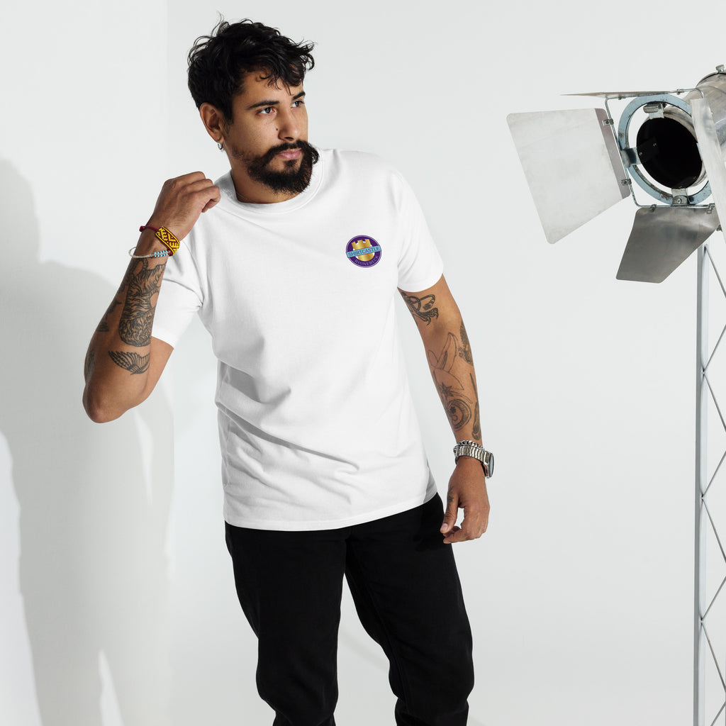 a model wears a white shirtcastle t shirt against a white backdrop with stage lights